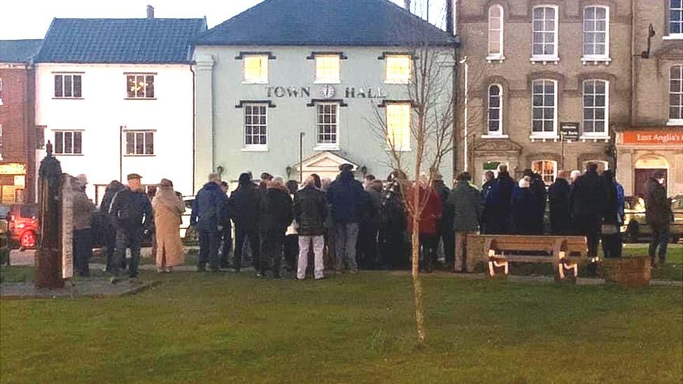 Crowd gathered in a town centre