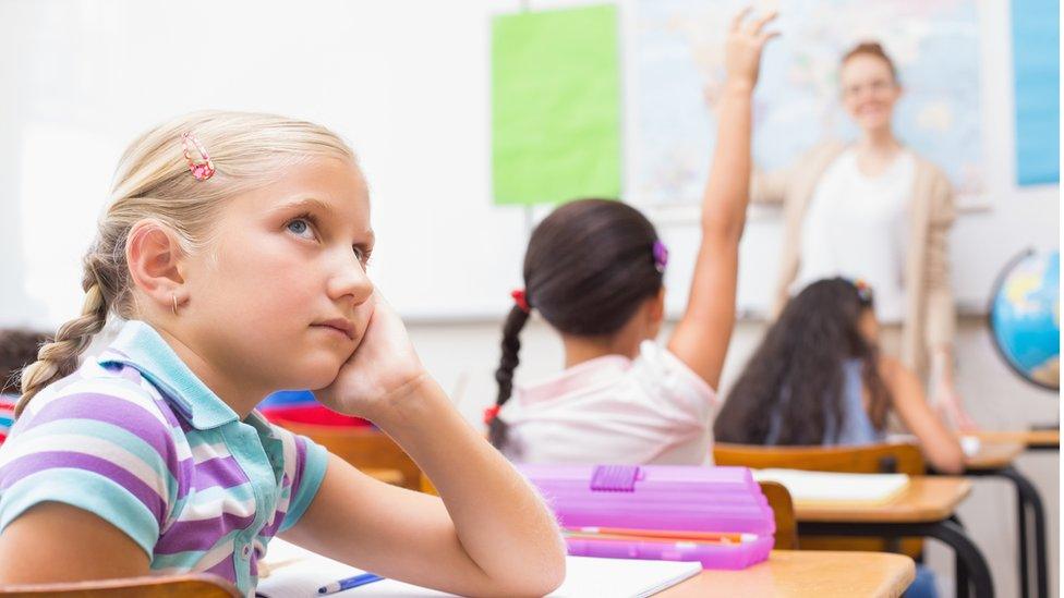 child daydreaming in class