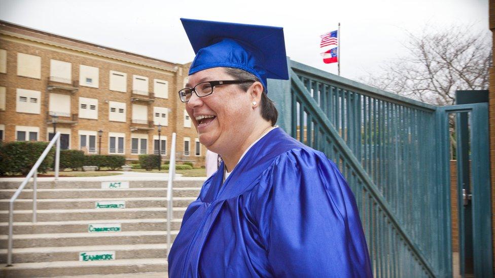 Gissendaner in graduation robes after receiving a certificate of theological studies