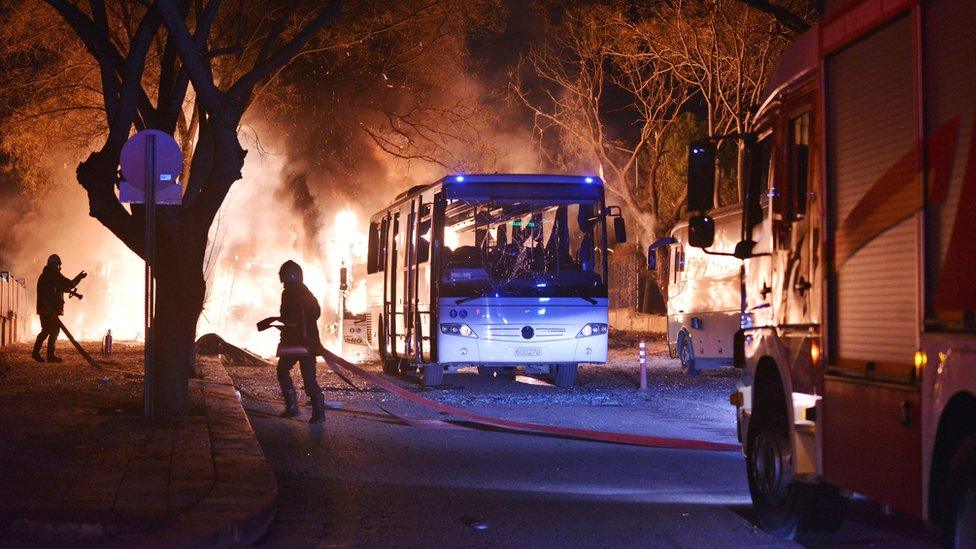 Firefighters work at a scene of fire from an explosion in Ankara