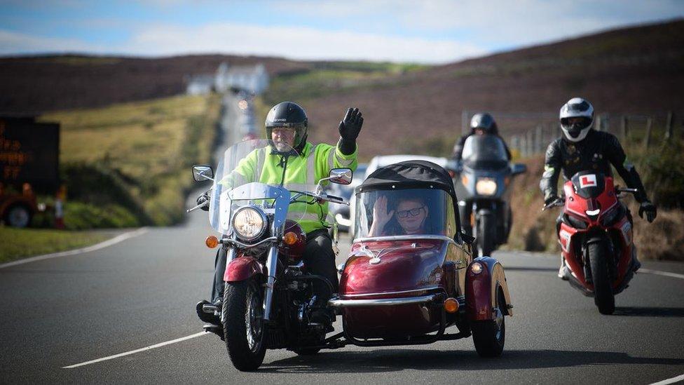 Motorcycle with sidecar taking part in the lap