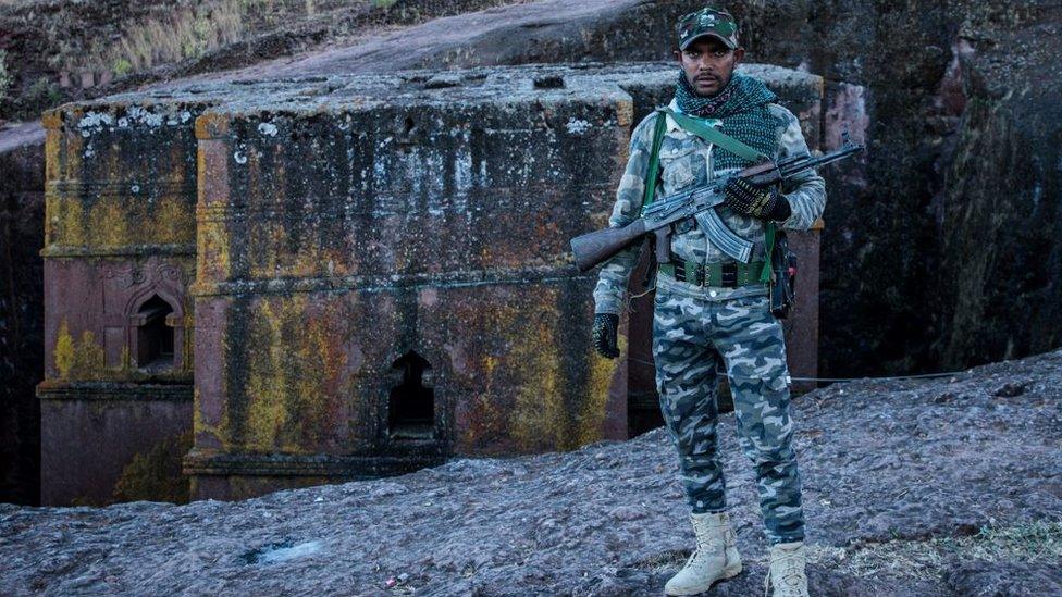 An Amhara Fano militia fighter poses at Saint George Church in Lalibela, Ethiopia - 7 December 2021