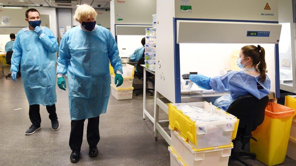 Prime Minister Boris Johnson is shown the Lighthouse Laboratory used for processing PCR samples