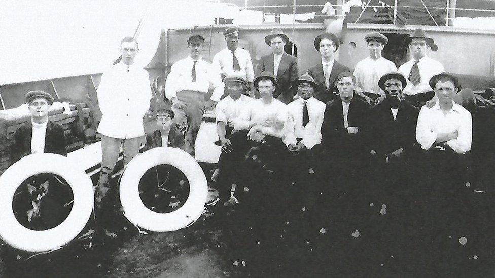 A crew aboard a merchant navy ship