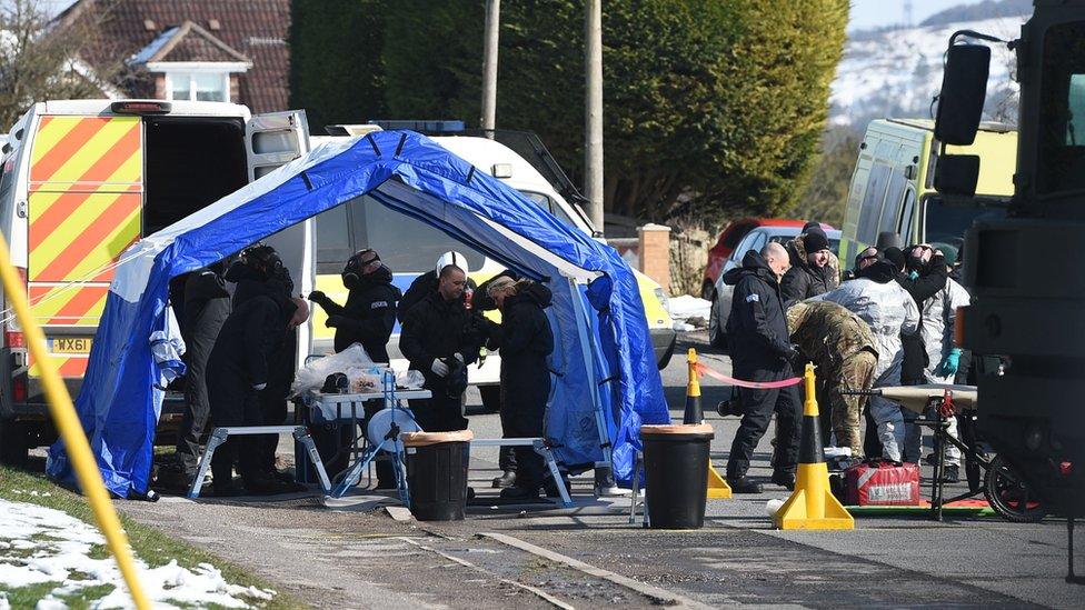 Police and army personnel dress in Durrington, Salisbury, as the investigation into the suspected nerve agent attack on Russian double agent Sergei Skripal continues