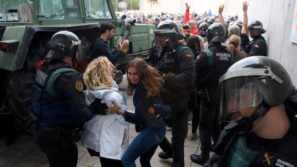 Spanish civil guards outside a polling station in Sarria de Ter