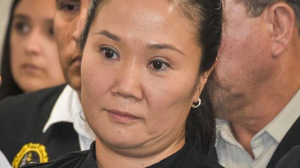 Keiko Fujimori (C) is detained