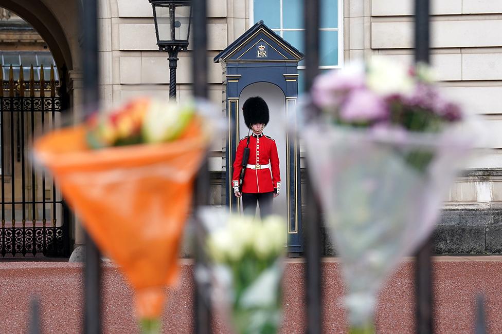 Flowers and tributes to Queen Elizabeth II are pictured outside of Buckingham Palace in London on 9 September 2022