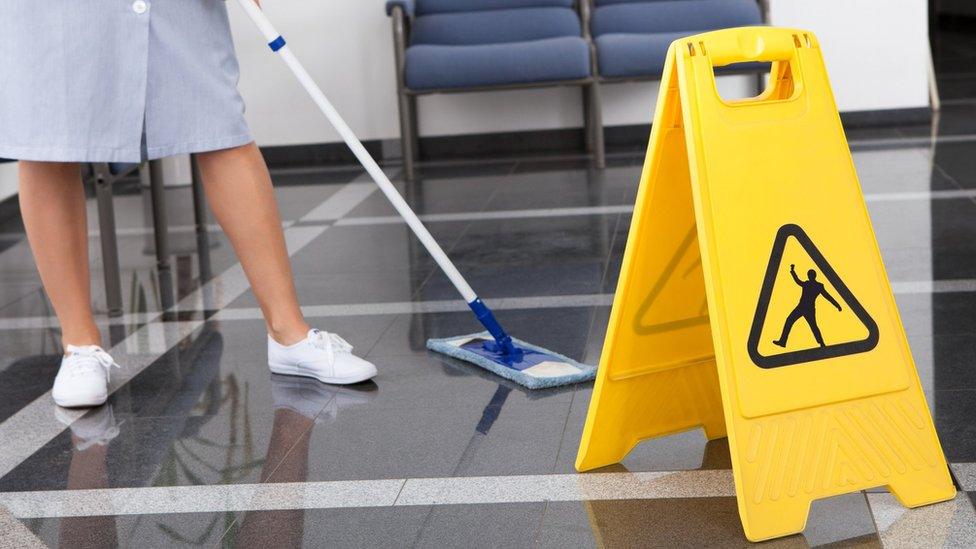 woman mopping floor