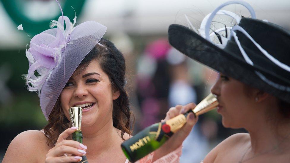 Two ladies drinking champagne