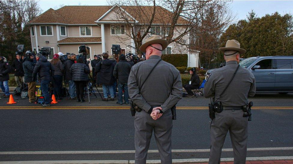 Police outside the house where the stabbing took place