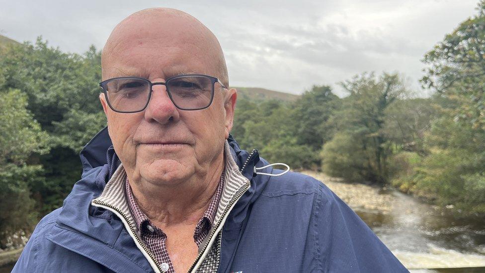 John Phillips stood in front of the River Afan