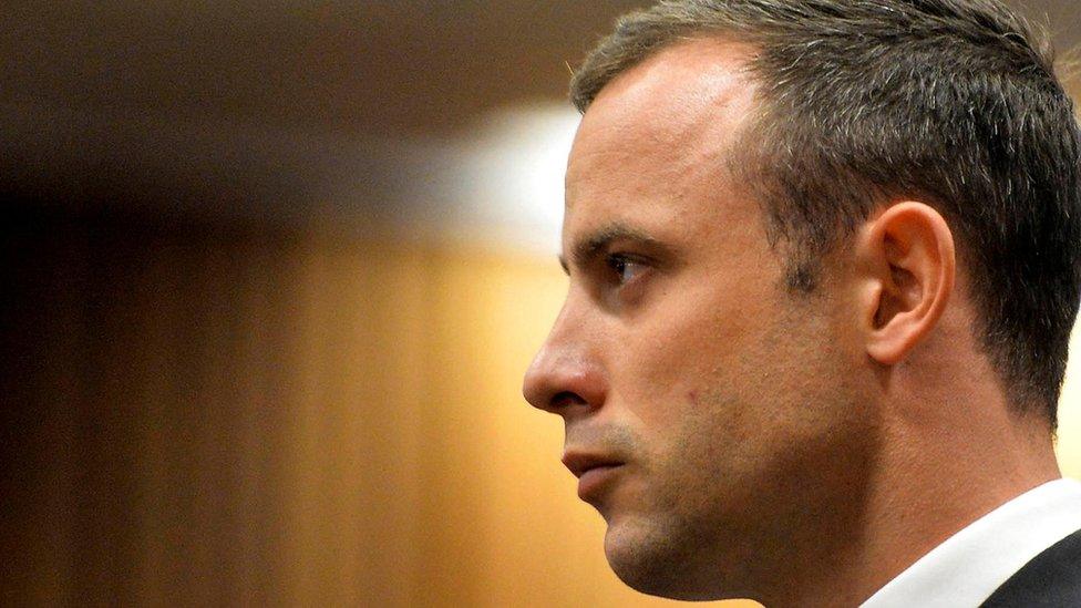 Olympic and Paralympic track star Oscar Pistorius stands in the dock during his trial at the North Gauteng High Court in Pretoria March 3, 2014.