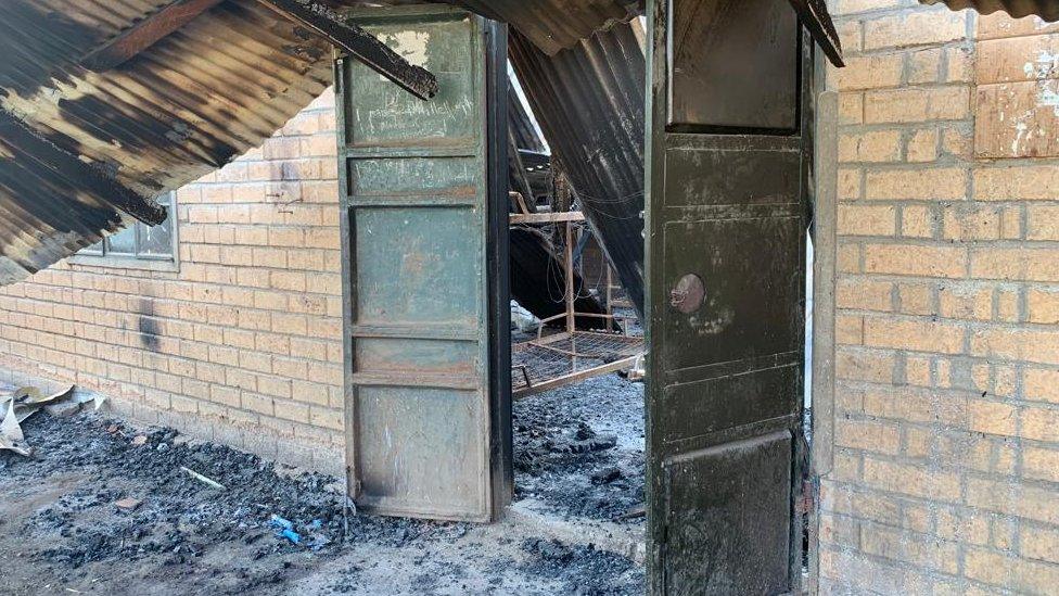 The burnout remnants of the boys' dormitory at the school in Mpondwe, Uganda - 18 June 2023