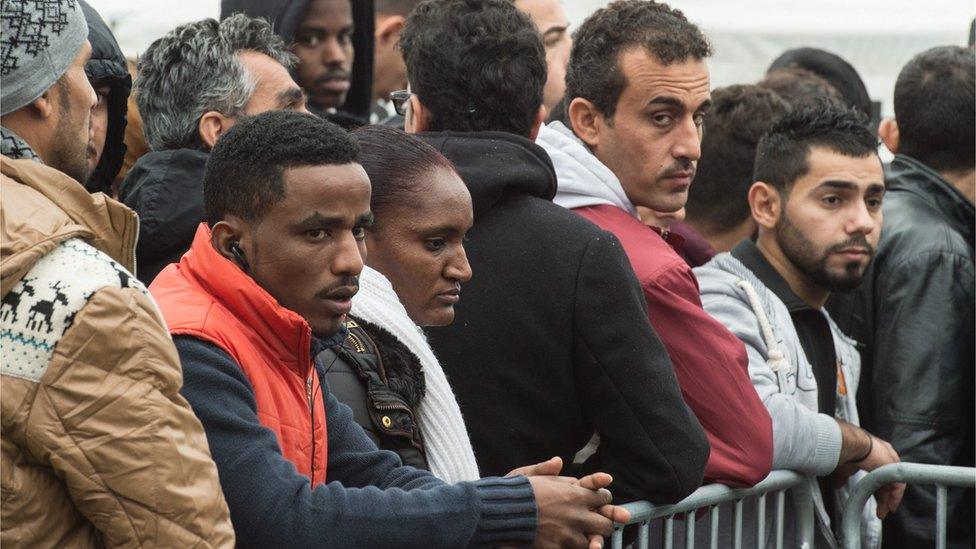 Recently arrived refugees wait for registration at the Hessian Initial Reception Center (HEAE) in Giessen, Germany, 02 December 2015.