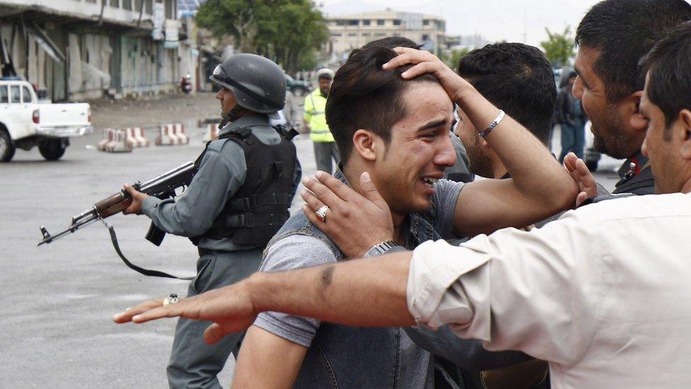 An unidentified relative of one of the victims of a suicide bomb blast in central Kabul on Tuesday 19 April 2016 reacts