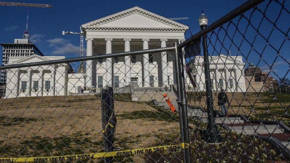 Fencing surrounds the front of the Virginia State House in Richmond,