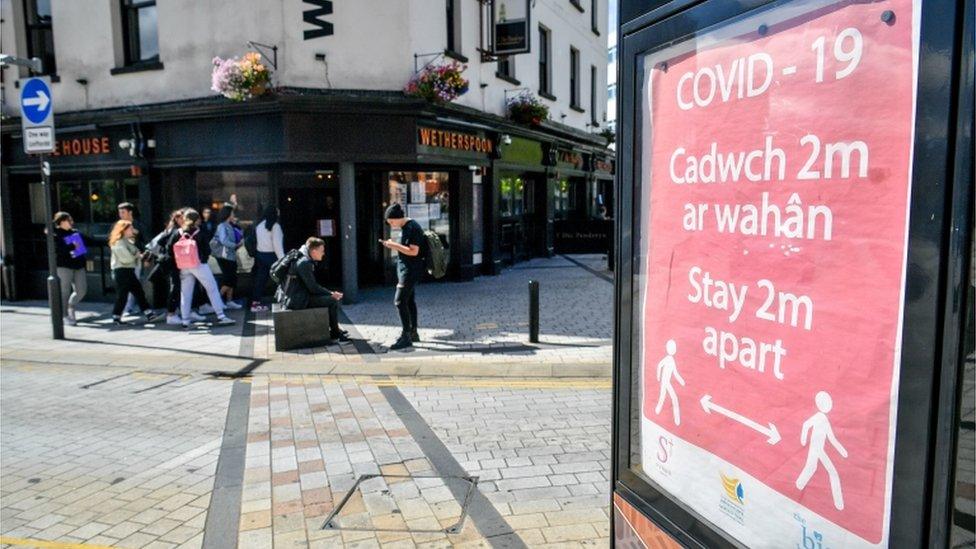 A covid-19 poster opposite a pub in Merthyr Tydfi