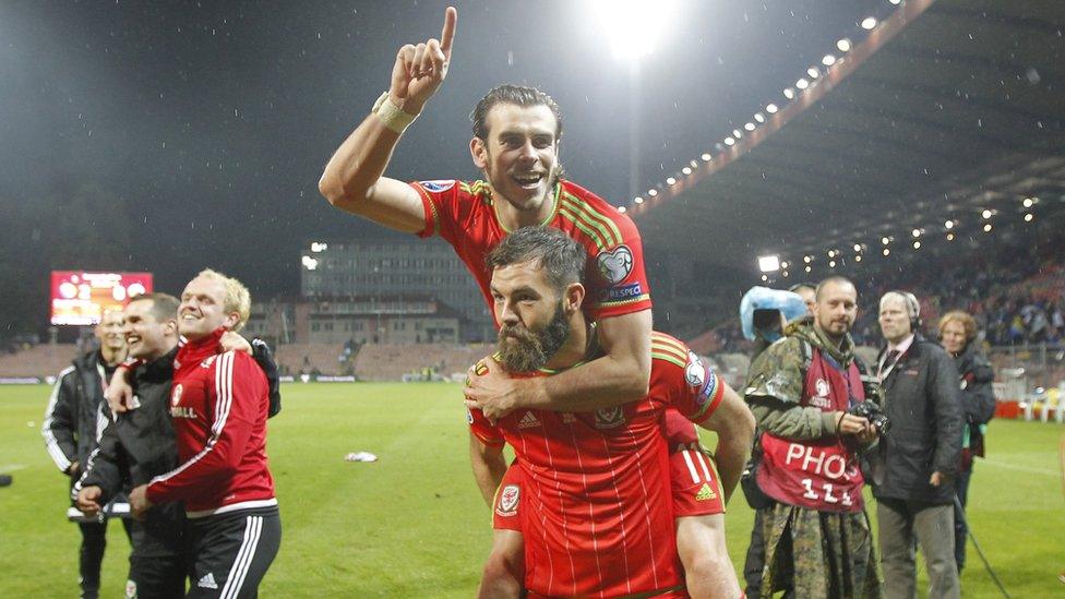 Joe Ledley gives Gareth Bale a celebratory piggyback.