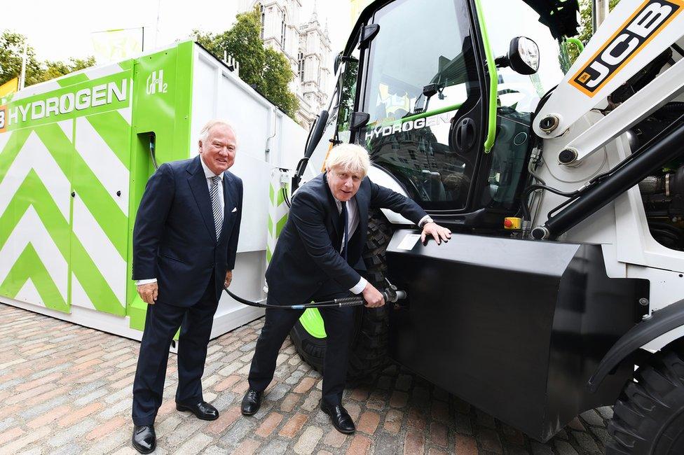 Prime Minister Boris Johnson refuels JCB's prototype hydrogen powered backhoe loader