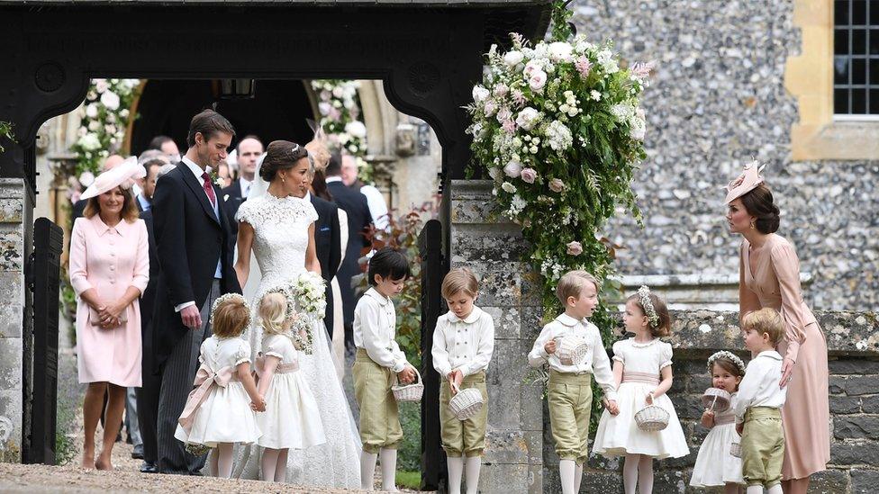 Duchess of Cambridge stands with her children Prince George and Princess Charlotte, following the wedding of her sister Pippa Middleton to James Matthews