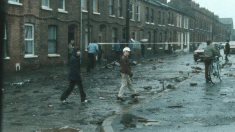 Bricks and slates littering a street after tornado