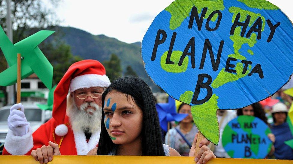 People take part in the Global Climate March in Bogota, Colombia, on November 29, 2015, on the eve of the UN conference on climate change COP 21, to take place in Paris.