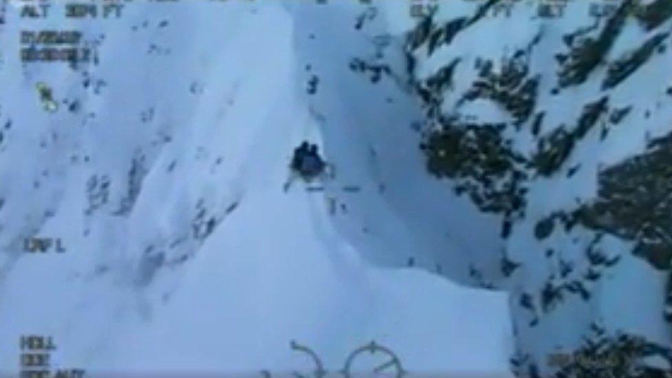 Coastguard footage of the men on the ridge