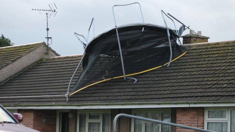 Trampoline on house roof at Cardigan