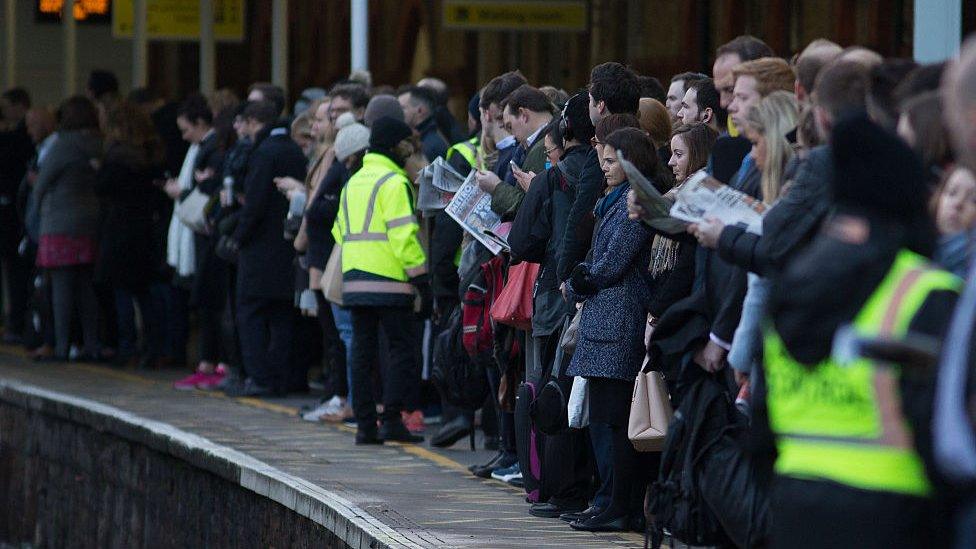 Commuters waiting at a station