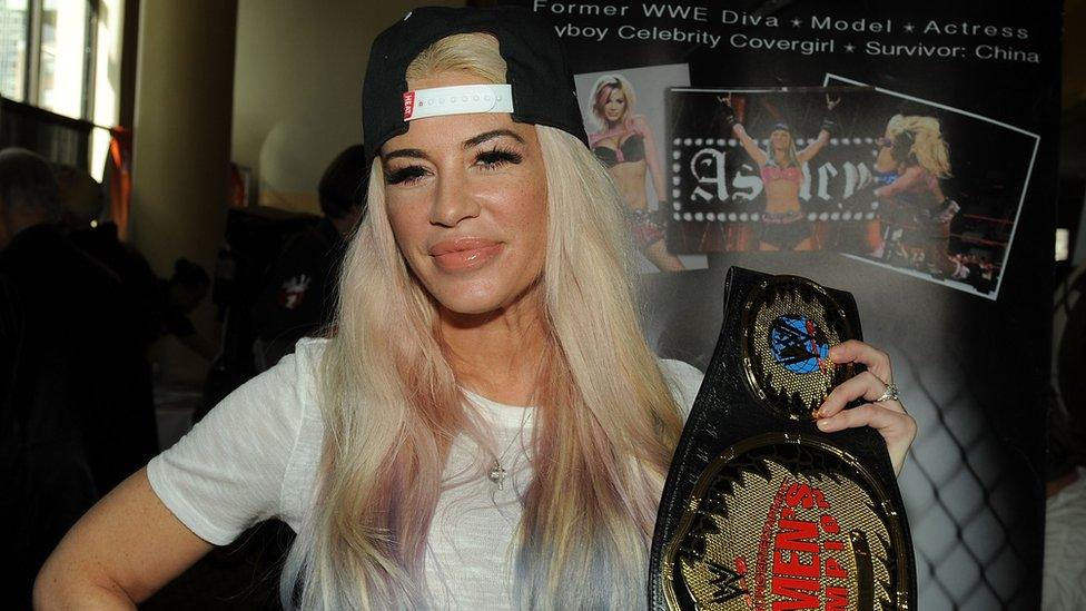 Ashley Massaro holding a WWE belt