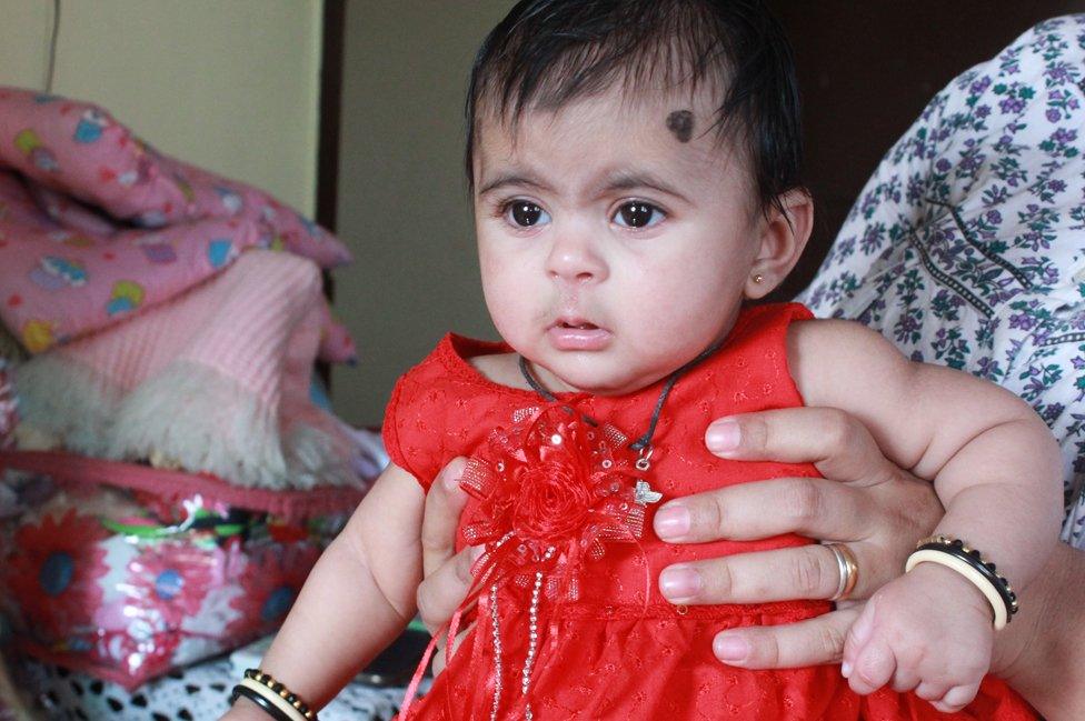 Hufriya in her red dress