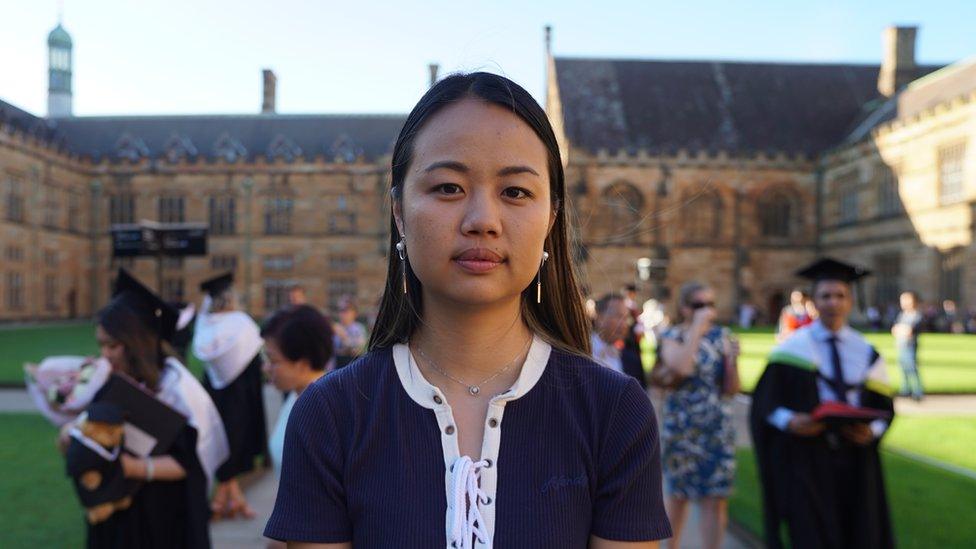 Liliana Tai in front of university graduates at the University of Sydney