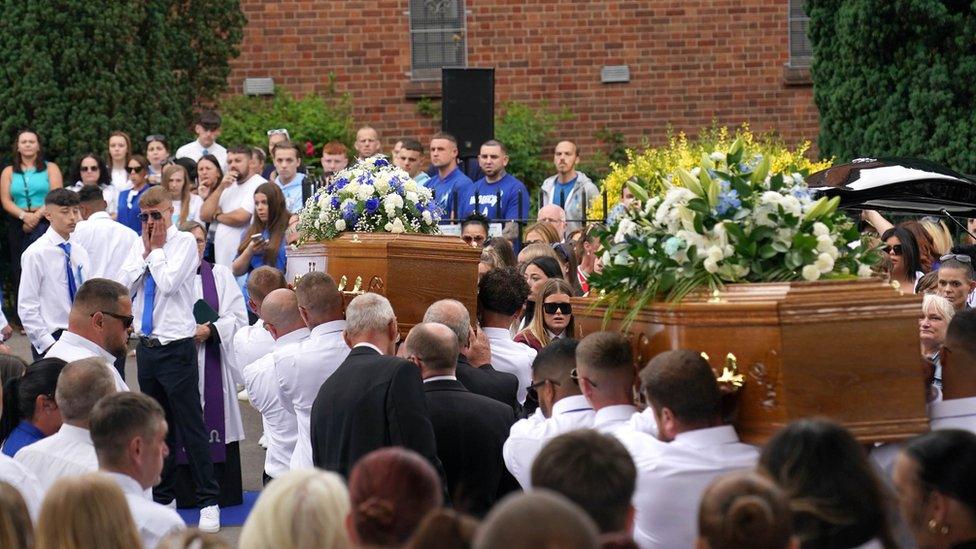 Coffins carried out