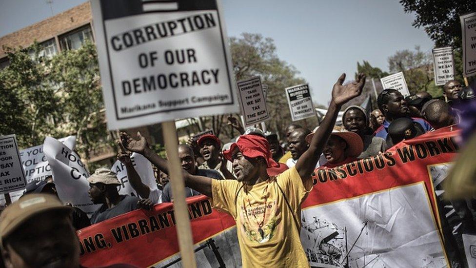 An anti-corruption activist shouts political slogans on 30 September 2015 in Pretoria, as thousands of protesters march to the Union Buildings, during a demonstration against corruption organized by various South African unions and political and civil societies.