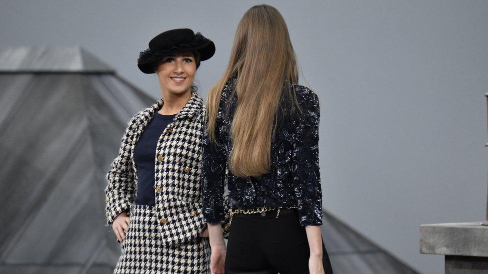 Marie S'Infiltre on the runway and the back of model Gigi Hadid