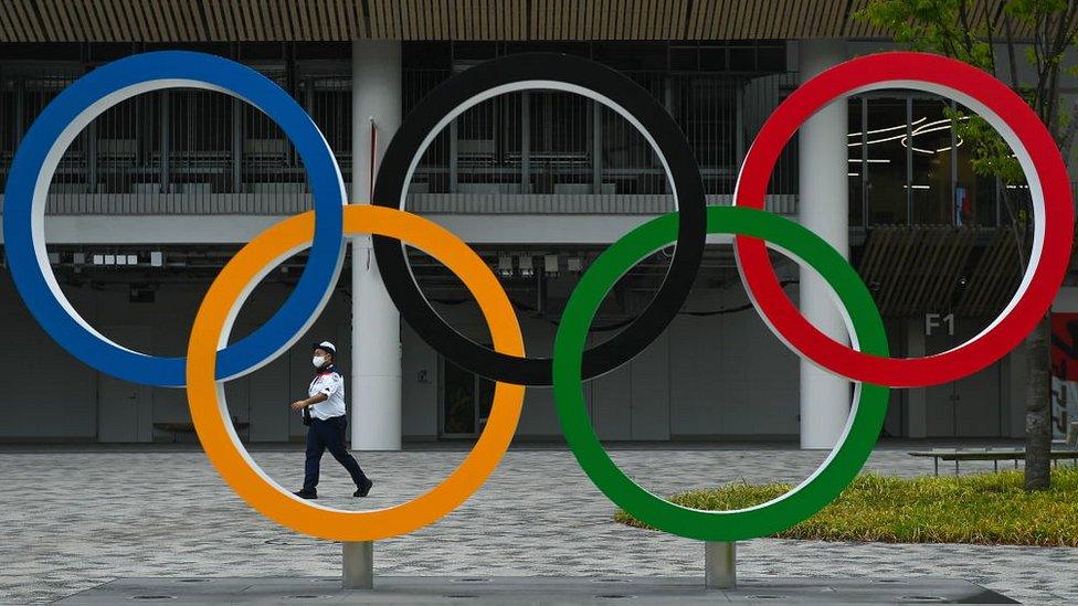 A security guard on duty outside the Olympic Stadium of the 2020 Tokyo Summer Olympic Games in Japan.