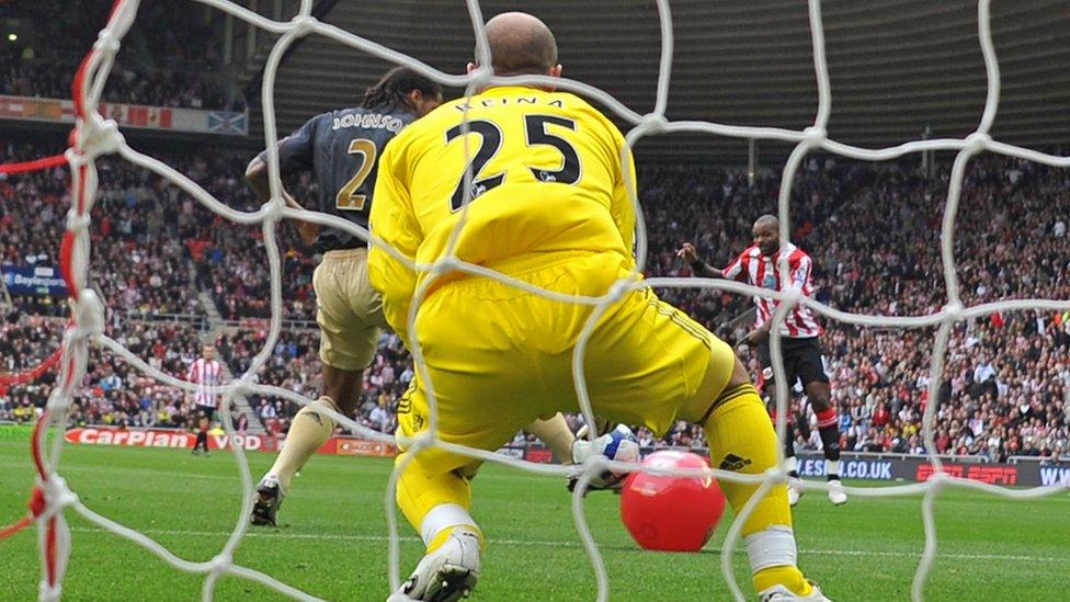 Pepe Reina watches as a football clatters into a beachball on the football pitch