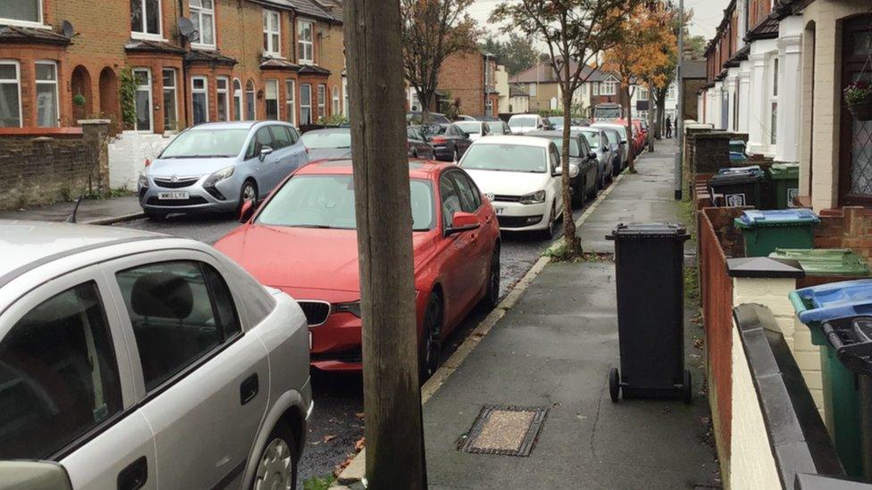 A street in Watford with cars on