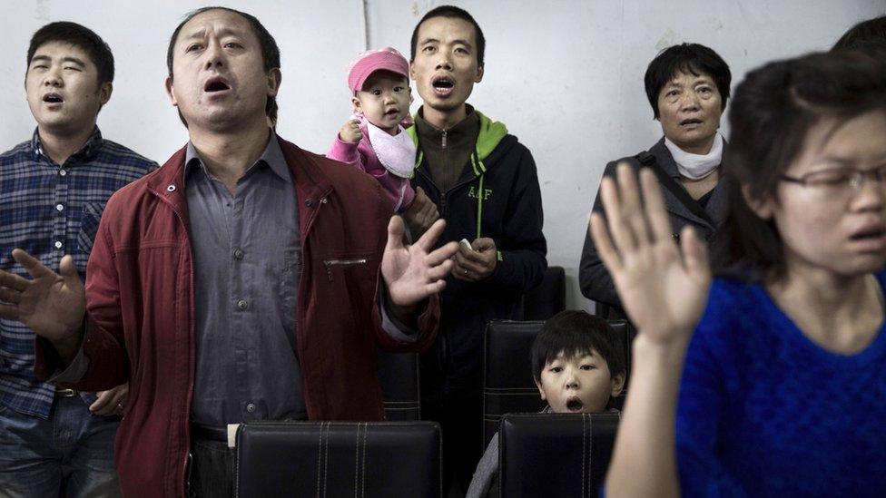 Protestants pray at an underground church