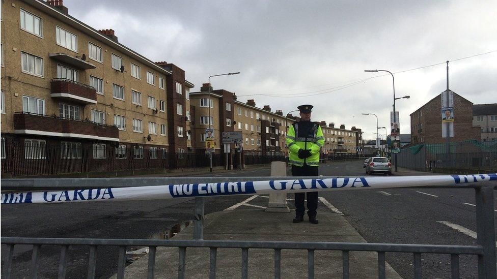 Police officer guards a cordon near the scene of the murder of Eddie Hutch Snr in inner city Dublin