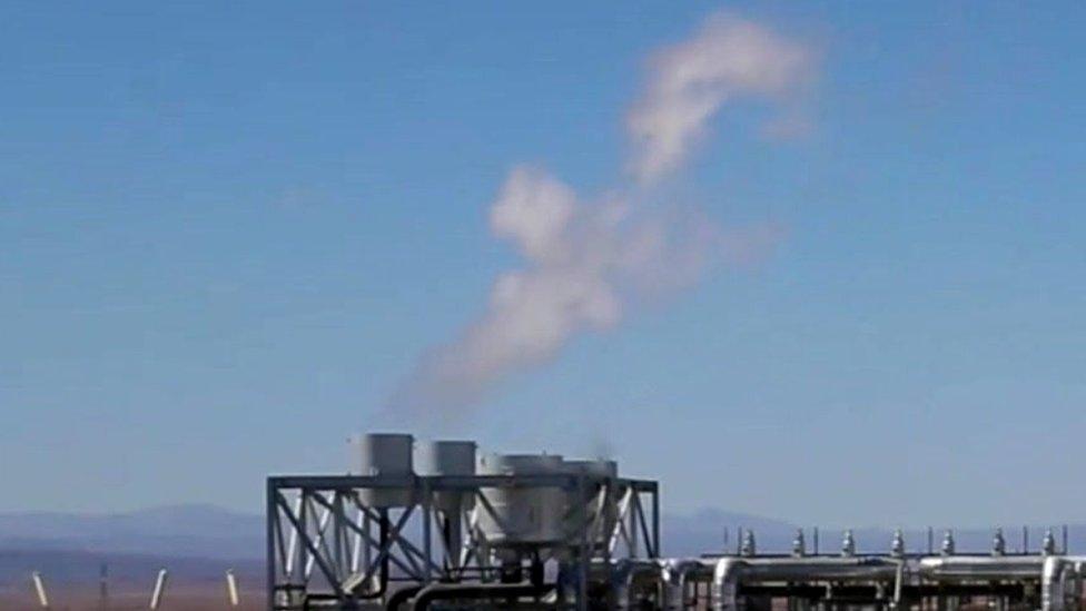 Steam billows from a chimney at the solar power plant in Morocco