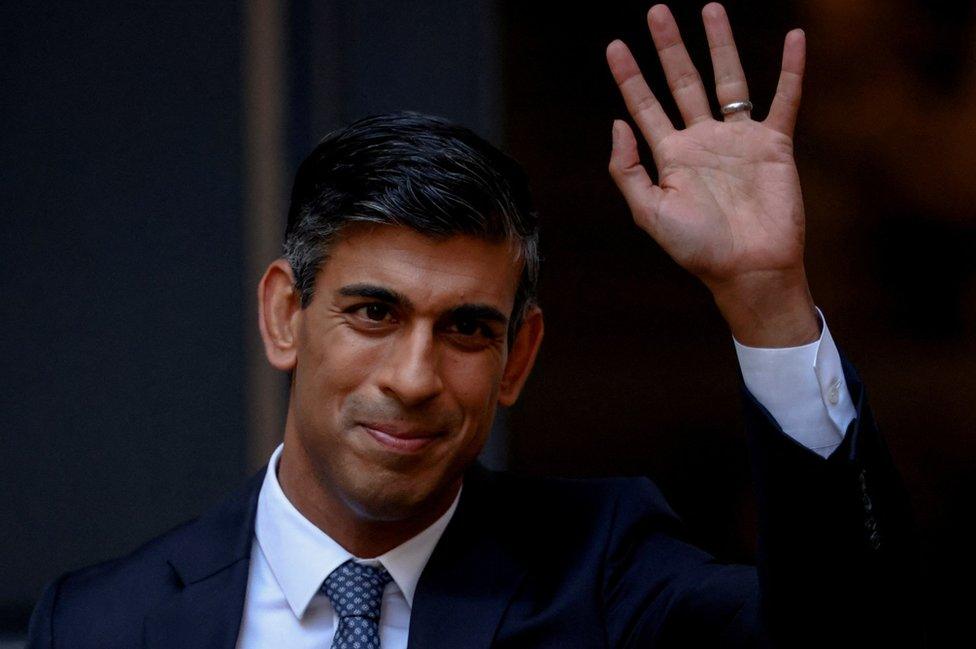 Rishi Sunak outside the Conservative campaign headquarters in London