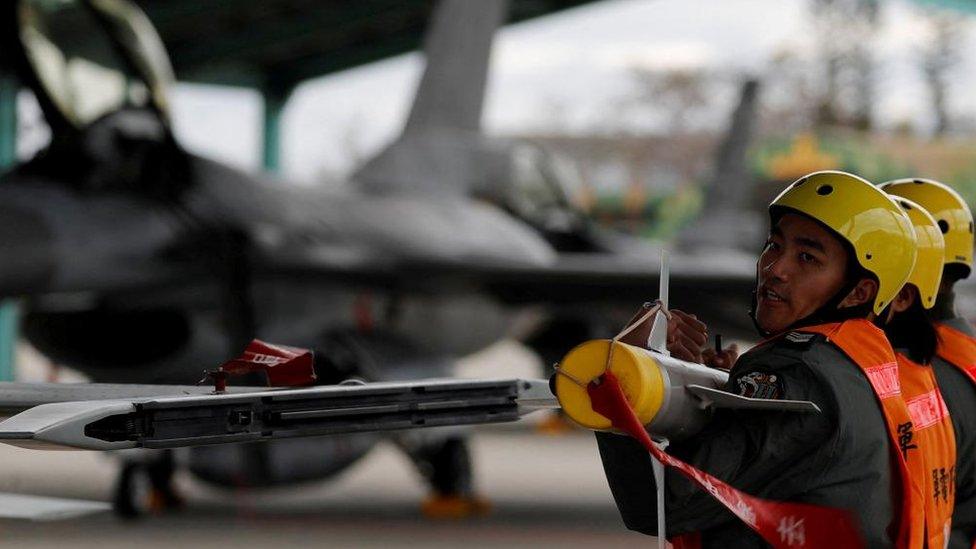 Taiwan air force crews lift a missile