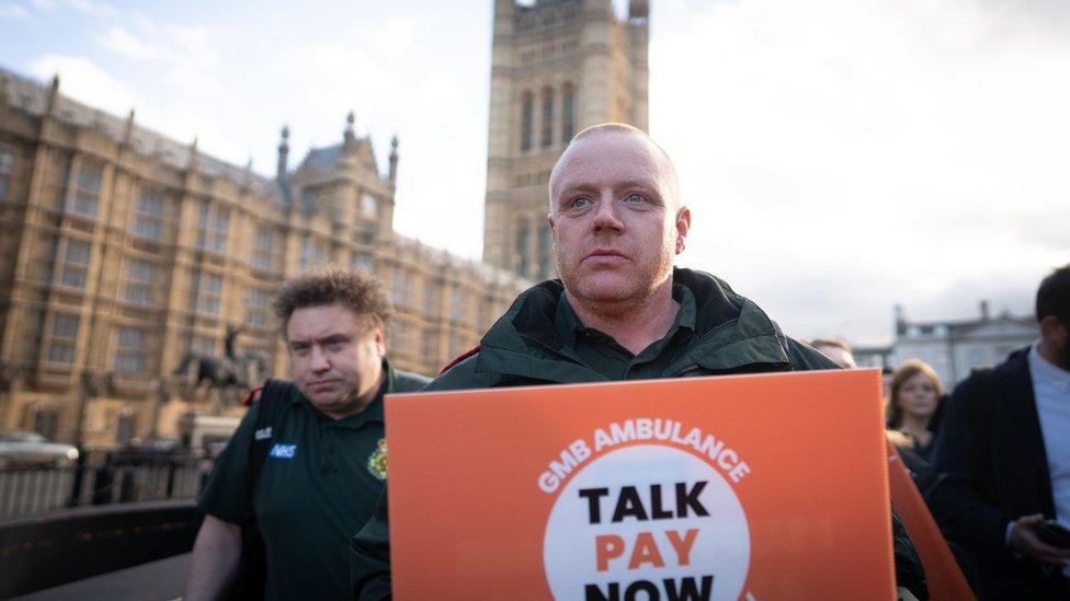 Ambulance worker from GMB union outside the Houses of Parliament