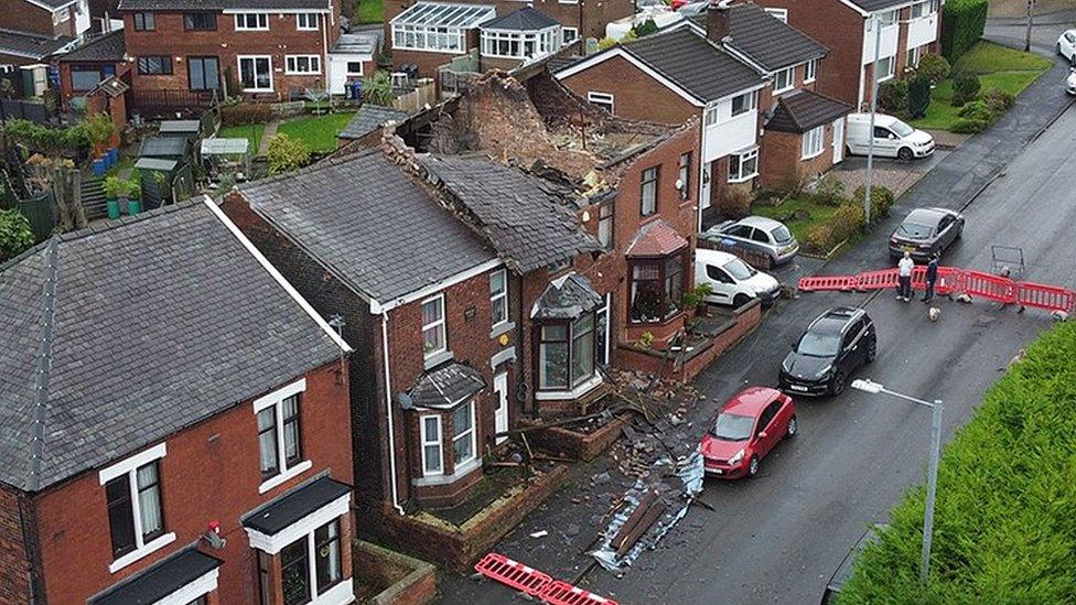 Aerial photograph of a house which had its roof ripped off during a localized tornado