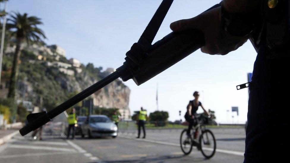 Armed police officer at the Franco-Italian border following Friday's attacks in Paris