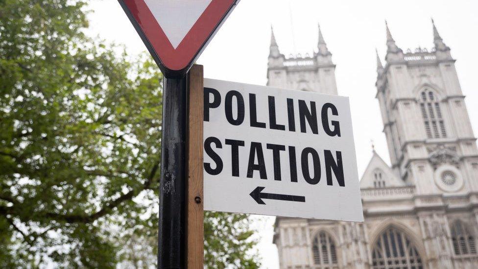 A signpost for a polling station