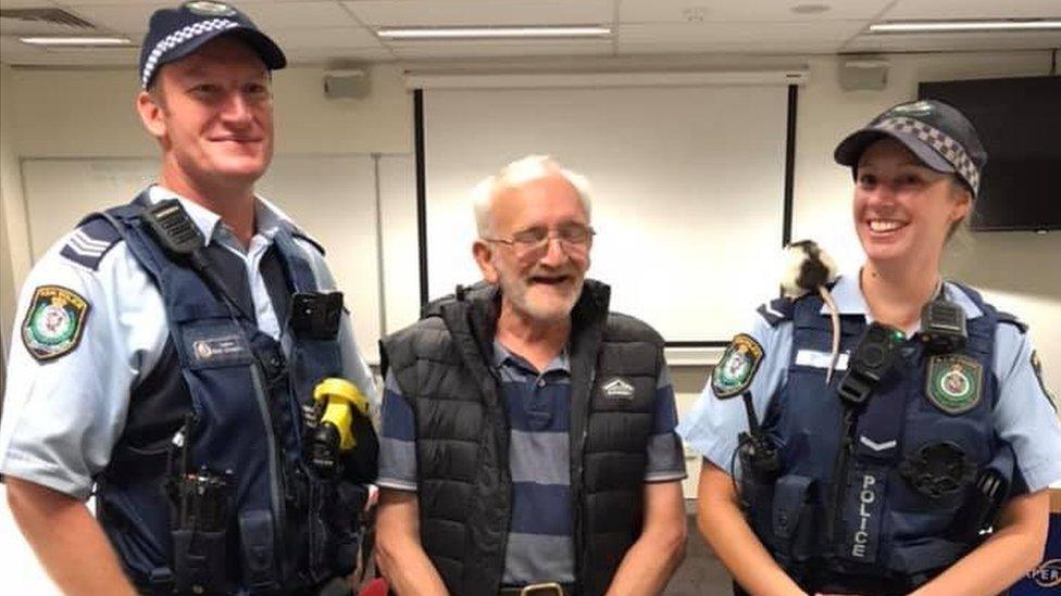 Chris and Lucy pose with police officers