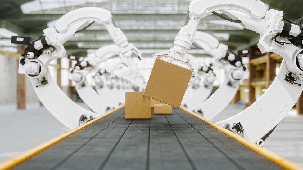 Automated warehouse with robotic arms